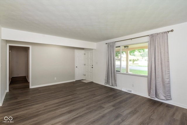 802 Lawrence Ave, Indianapolis, IN 46227 - spare room featuring dark wood-style floors and baseboards