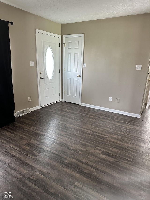 1108 Pierce Dr, Plainfield, IN 46168 - foyer featuring baseboards and dark wood-style flooring