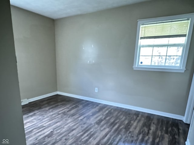 1108 Pierce Dr, Plainfield, IN 46168 - spare room featuring baseboards and dark wood finished floors