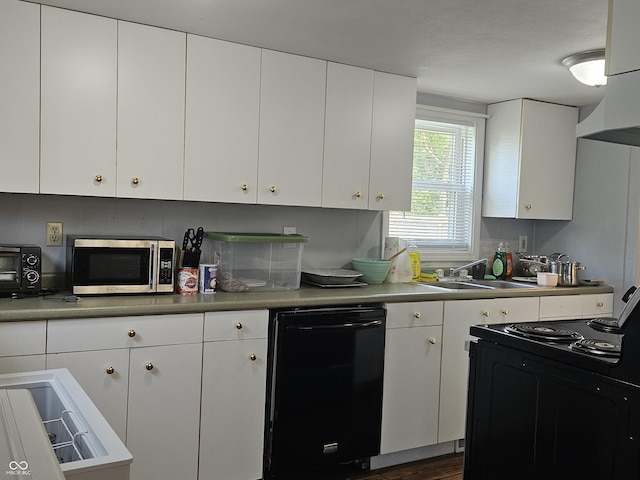 1601 S Biltmore Ave, Muncie, IN 47302 - kitchen with black appliances, white cabinetry, and light countertops