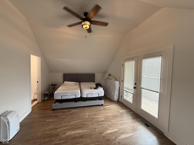 1720 Rembrandt St, Indianapolis, IN 46202 - bedroom featuring lofted ceiling, wood finished floors, french doors, ceiling fan, and access to exterior