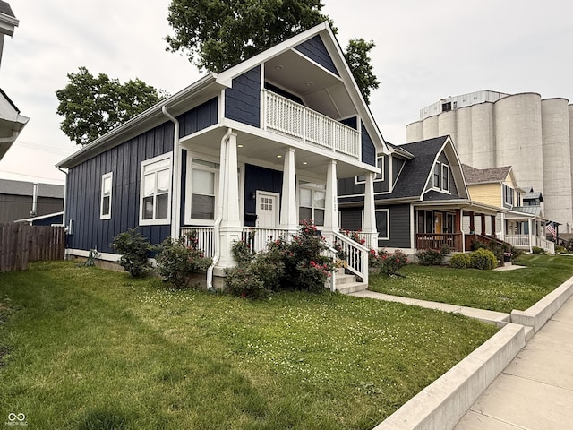 1720 Rembrandt St, Indianapolis, IN 46202 - view of front of home with board and batten siding, a balcony, and a porch