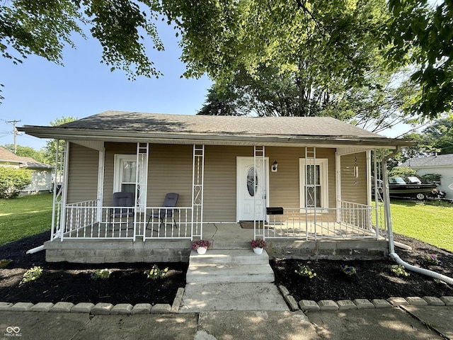 212 W Wilson St, Greensburg, IN 47240 - bungalow-style house with covered porch and roof with shingles