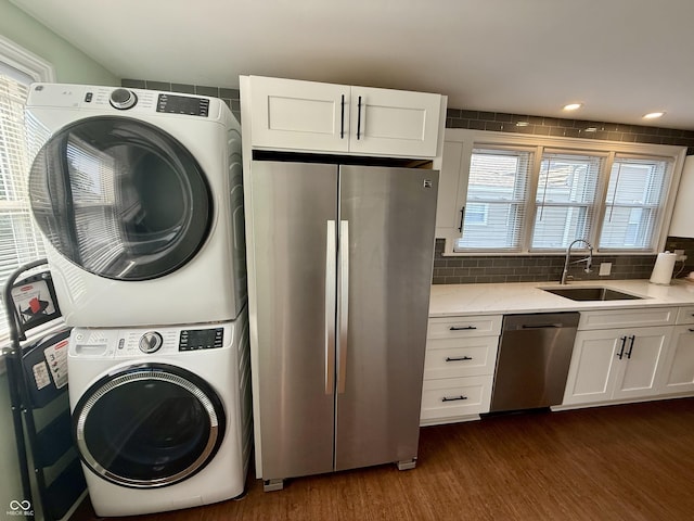 820 N Broadway St, Greensburg, IN 47240 - laundry room with stacked washer / dryer, dark wood-type flooring, and recessed lighting