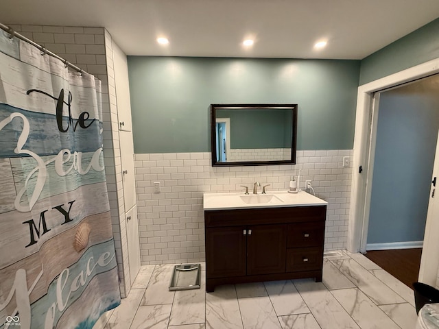 820 N Broadway St, Greensburg, IN 47240 - bathroom featuring tile walls, vanity, marble finish floors, recessed lighting, and wainscoting