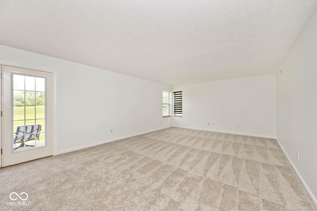 11320 Lynchburg Way, Indianapolis, IN 46229 - spare room with light carpet and a textured ceiling