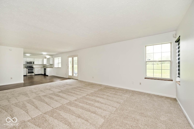 11320 Lynchburg Way, Indianapolis, IN 46229 - unfurnished living room with dark colored carpet and a textured ceiling