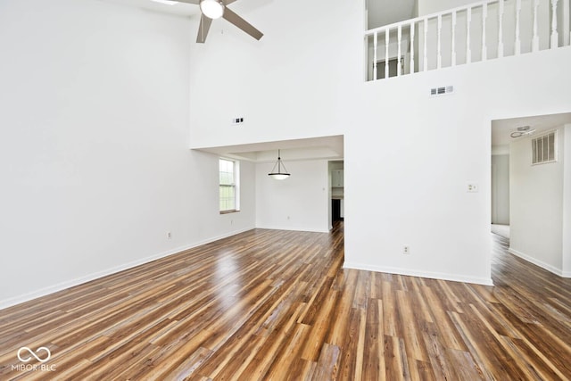 11320 Lynchburg Way, Indianapolis, IN 46229 - unfurnished living room with a high ceiling, ceiling fan, and wood finished floors