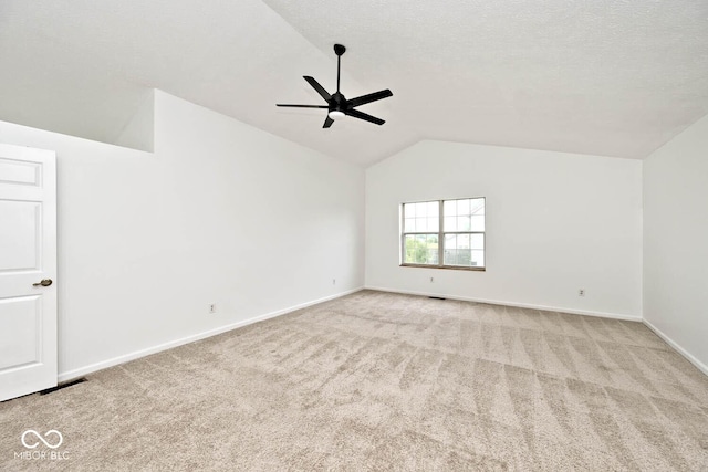 11320 Lynchburg Way, Indianapolis, IN 46229 - spare room featuring a ceiling fan, vaulted ceiling, and carpet