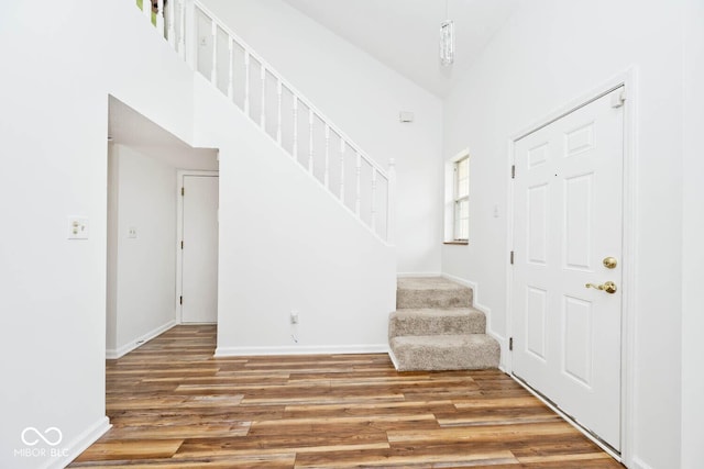 11320 Lynchburg Way, Indianapolis, IN 46229 - entryway with stairway, wood finished floors, and a towering ceiling