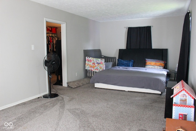219 N 9th Ave, Beech Grove, IN 46107 - carpeted bedroom with a spacious closet and a textured ceiling