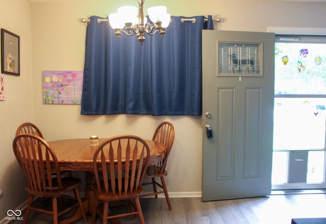 219 N 9th Ave, Beech Grove, IN 46107 - dining area with a chandelier and wood finished floors