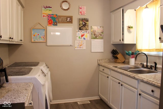 219 N 9th Ave, Beech Grove, IN 46107 - laundry area featuring washer and clothes dryer, cabinet space, and dark wood-style floors