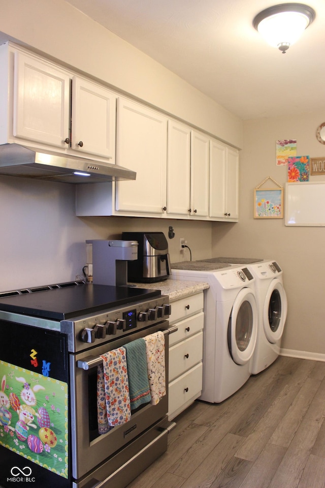 219 N 9th Ave, Beech Grove, IN 46107 - laundry area featuring washer and clothes dryer and light wood-style flooring