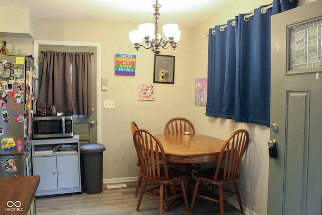 219 N 9th Ave, Beech Grove, IN 46107 - dining room with a chandelier and wood finished floors