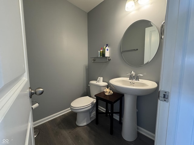 8969 Faulkner Dr, Indianapolis, IN 46239 - bathroom with wood finished floors and toilet