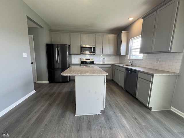 8969 Faulkner Dr, Indianapolis, IN 46239 - kitchen with stainless steel appliances, gray cabinets, backsplash, dark wood-type flooring, and recessed lighting