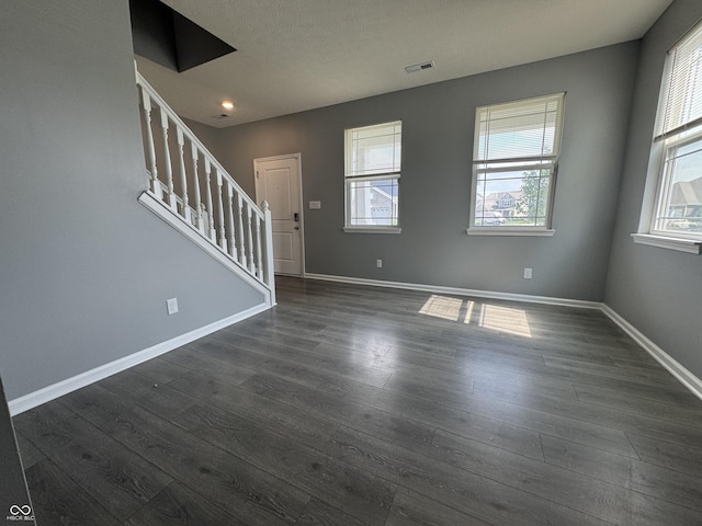 8969 Faulkner Dr, Indianapolis, IN 46239 - entryway featuring plenty of natural light, stairway, and dark wood finished floors