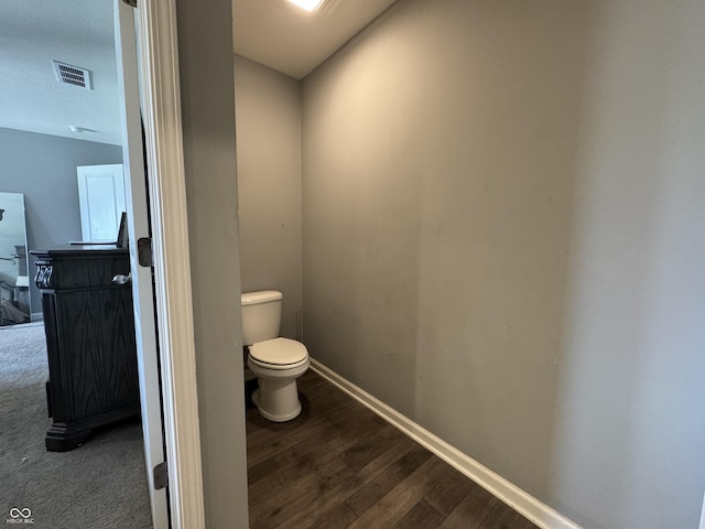 8969 Faulkner Dr, Indianapolis, IN 46239 - bathroom with toilet and wood finished floors