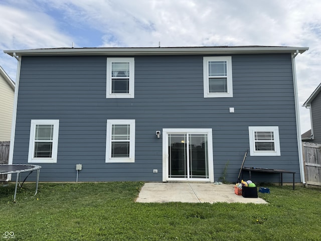 8969 Faulkner Dr, Indianapolis, IN 46239 - rear view of house with a trampoline and a patio area