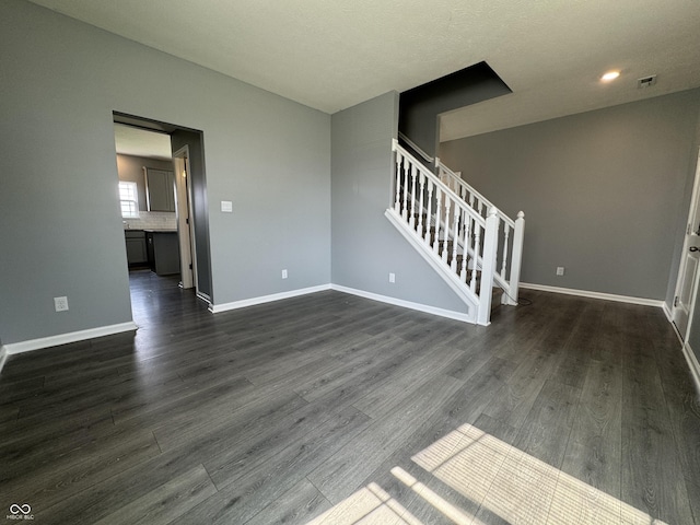 8969 Faulkner Dr, Indianapolis, IN 46239 - spare room featuring dark wood-style floors, stairs, and recessed lighting
