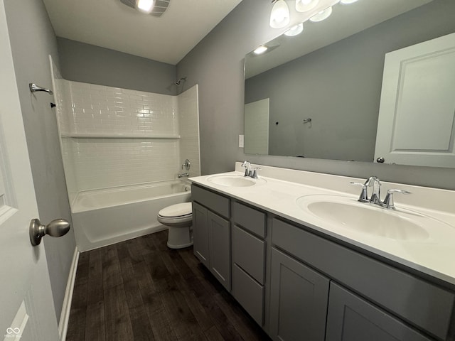 8969 Faulkner Dr, Indianapolis, IN 46239 - bathroom featuring wood finished floors, double vanity, and washtub / shower combination