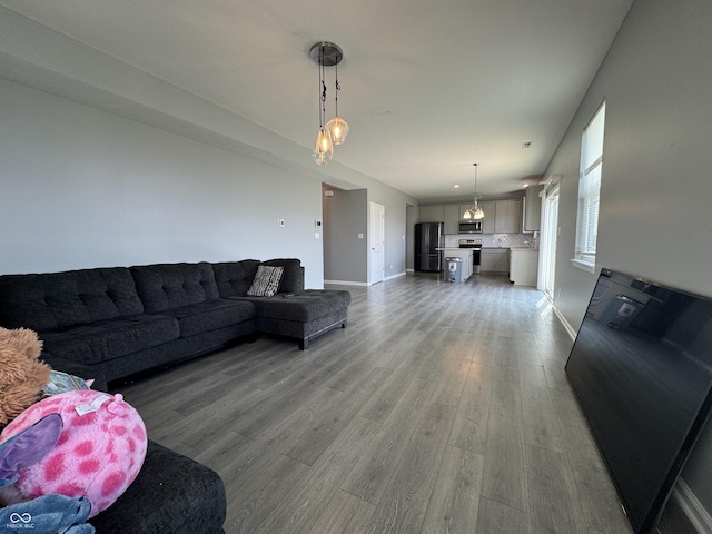 8969 Faulkner Dr, Indianapolis, IN 46239 - living room featuring wood finished floors and baseboards