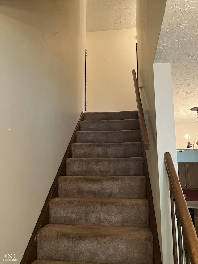 7667 Madden Ln, Fishers, IN 46038 - stairs with a textured ceiling