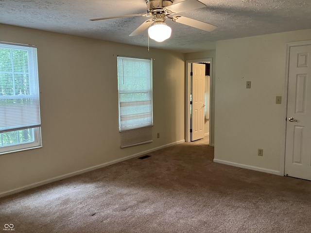 7667 Madden Ln, Fishers, IN 46038 - unfurnished room with a textured ceiling, healthy amount of natural light, carpet flooring, and ceiling fan