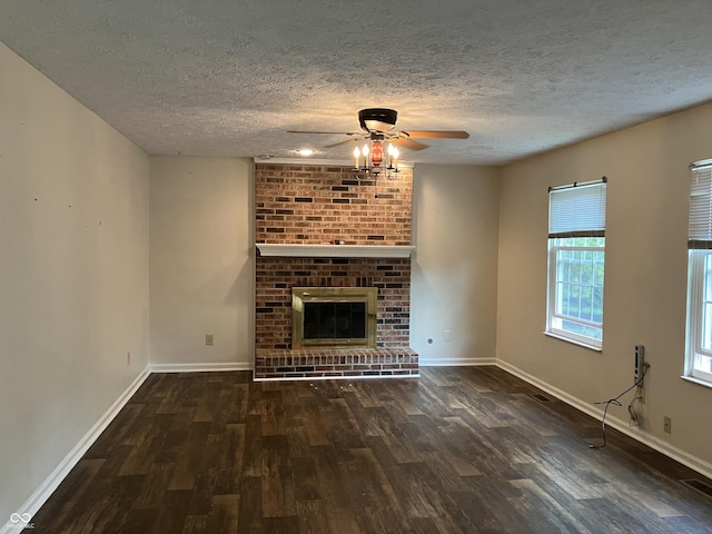 7667 Madden Ln, Fishers, IN 46038 - unfurnished living room with a ceiling fan, wood finished floors, a textured ceiling, and a fireplace