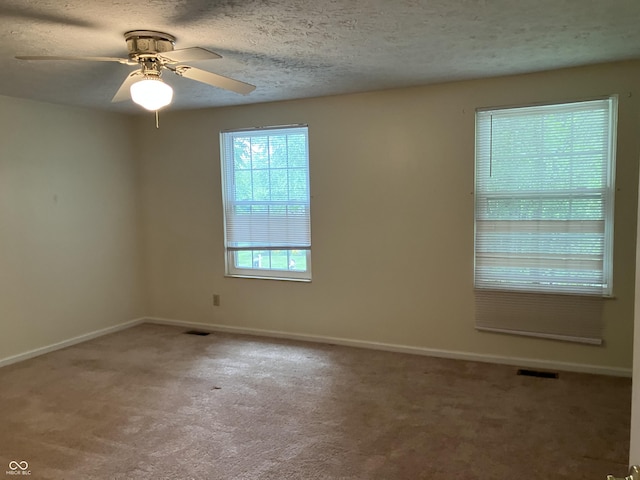 7667 Madden Ln, Fishers, IN 46038 - empty room featuring carpet floors, ceiling fan, and a textured ceiling