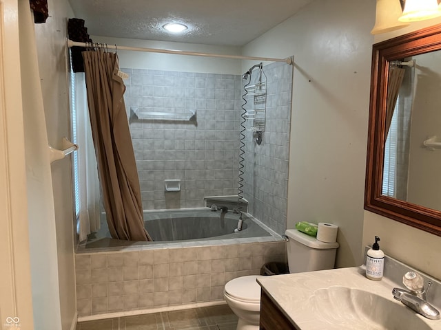 7667 Madden Ln, Fishers, IN 46038 - bathroom with tiled shower / bath combo, vanity, tile patterned flooring, and a textured ceiling