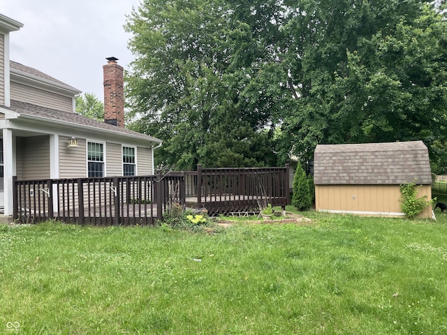 7667 Madden Ln, Fishers, IN 46038 - view of grassy yard featuring a storage shed and a wooden deck