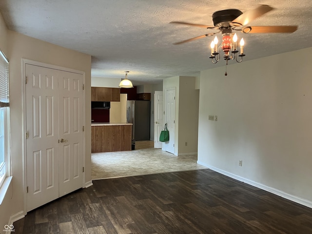 7667 Madden Ln, Fishers, IN 46038 - spare room featuring a ceiling fan, wood finished floors, and a textured ceiling
