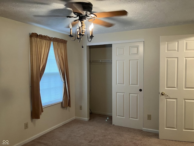 7667 Madden Ln, Fishers, IN 46038 - unfurnished bedroom with carpet, a closet, a textured ceiling, and a ceiling fan