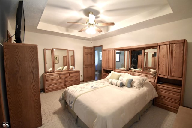 5943 Red Maple Dr, Indianapolis, IN 46237 - carpeted bedroom with a raised ceiling and a ceiling fan