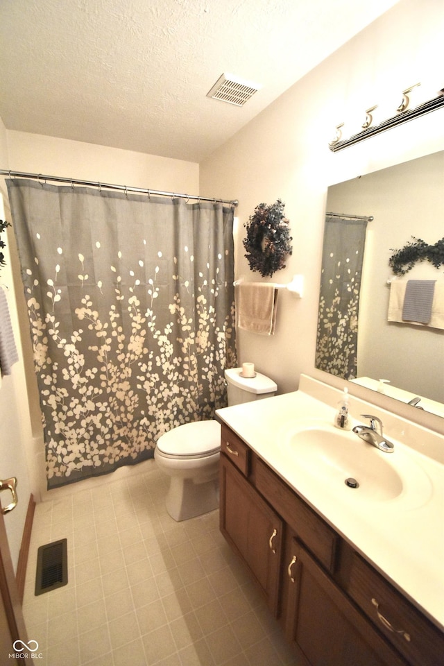 5943 Red Maple Dr, Indianapolis, IN 46237 - bathroom with vanity, a shower with shower curtain, and a textured ceiling