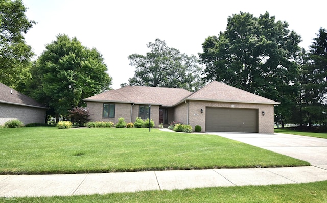 5943 Red Maple Dr, Indianapolis, IN 46237 - ranch-style house with an attached garage, driveway, a front lawn, and brick siding