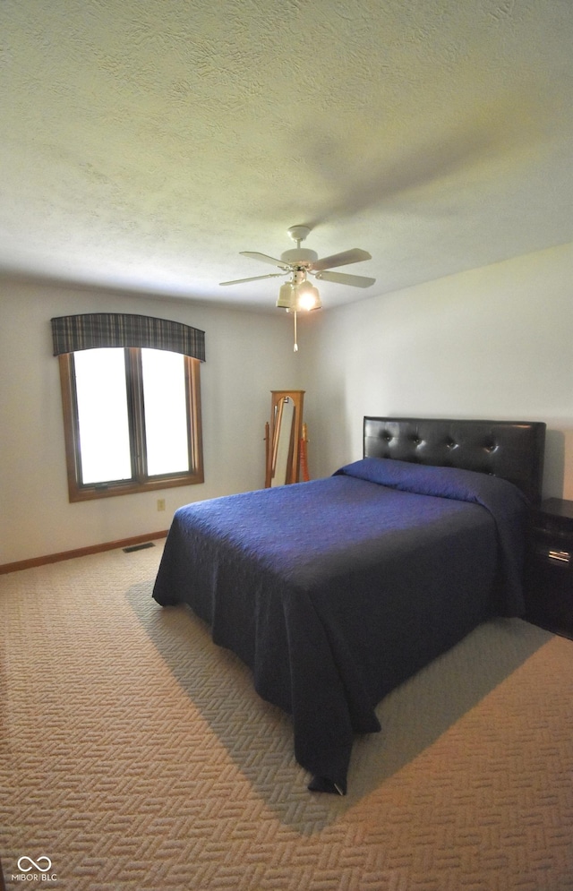 5943 Red Maple Dr, Indianapolis, IN 46237 - bedroom with carpet floors, a textured ceiling, and ceiling fan