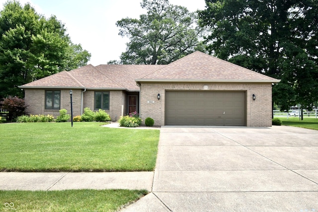 5943 Red Maple Dr, Indianapolis, IN 46237 - ranch-style home with brick siding, roof with shingles, a front yard, a garage, and concrete driveway