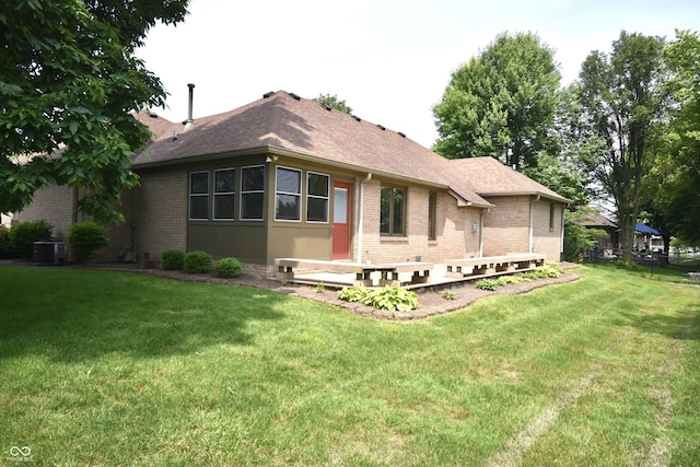 5943 Red Maple Dr, Indianapolis, IN 46237 - rear view of house with brick siding, a yard, and a shingled roof