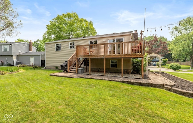 5802 Rymark Ct, Indianapolis, IN 46250 - rear view of property with a deck, stairs, and a yard