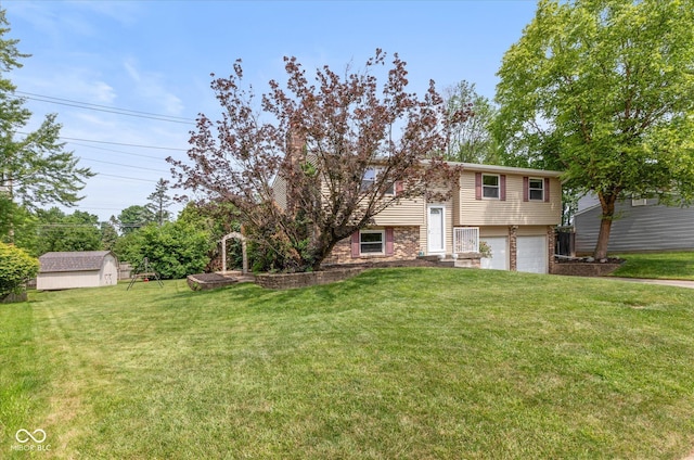 5802 Rymark Ct, Indianapolis, IN 46250 - view of green lawn featuring an attached garage and a shed