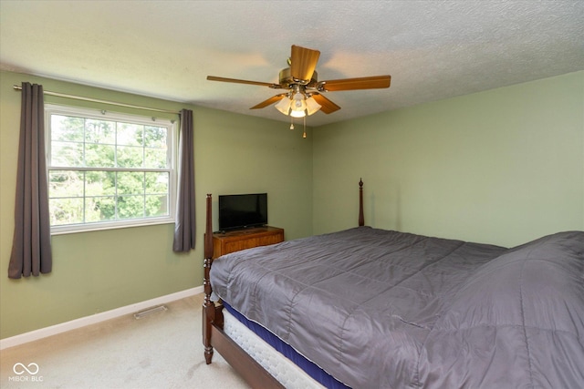 5802 Rymark Ct, Indianapolis, IN 46250 - carpeted bedroom featuring baseboards and ceiling fan