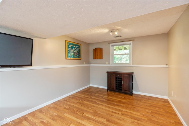 5802 Rymark Ct, Indianapolis, IN 46250 - empty room with light wood-type flooring and a textured ceiling