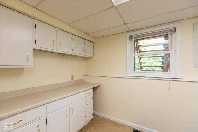 5802 Rymark Ct, Indianapolis, IN 46250 - kitchen with a paneled ceiling, white cabinets, and light countertops