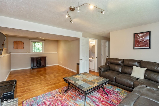 5802 Rymark Ct, Indianapolis, IN 46250 - living room featuring light wood finished floors and a textured ceiling
