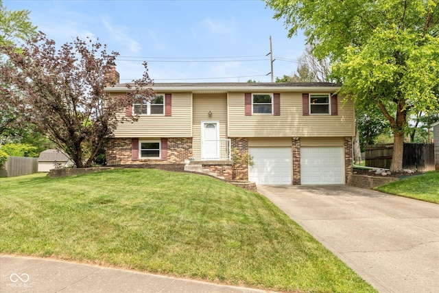 5802 Rymark Ct, Indianapolis, IN 46250 - split foyer home with brick siding, a garage, and concrete driveway