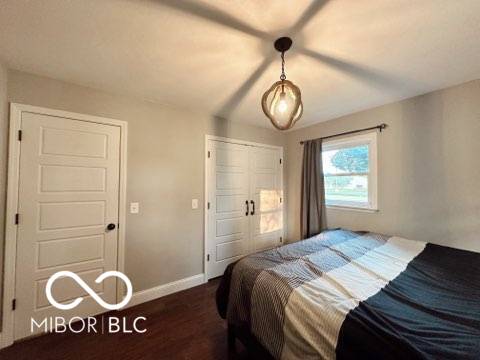 410 Hawthorn Ct, Seymour, IN 47274 - bedroom featuring wood finished floors and a closet
