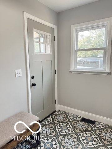 410 Hawthorn Ct, Seymour, IN 47274 - tiled entryway with baseboards